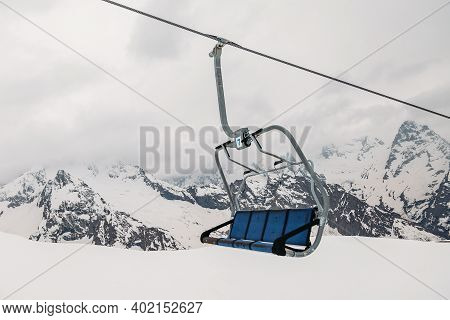 Ski Chair Lift Ropeway At The Ski Resort, View From The Funicular To The Mountains