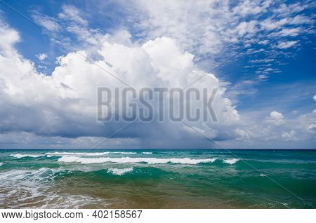 Seascape, Small Waves With White Foam At The Top Against The Background Of Blue Water. Low, Dense Cl