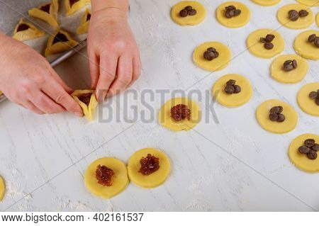 Making Hamentaschen Cookies With Jam For Purim. Jewish Holiday Concept,