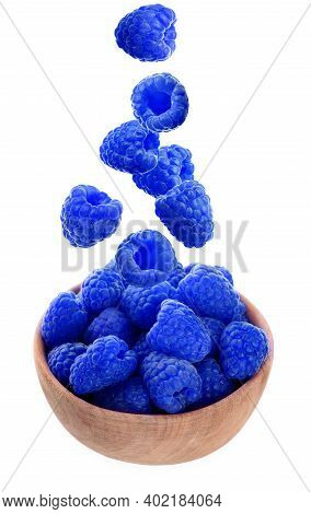Fresh Blue Raspberries Falling Into Bowl On White Background