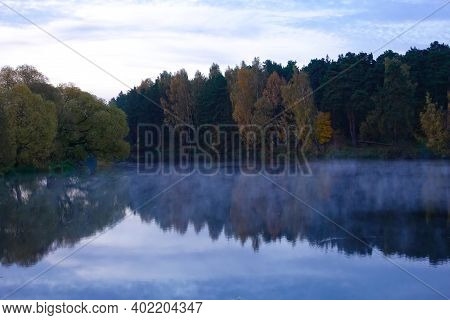 Early Morning On The Lake. Fog Over The Lake. Forest Lake In Calm Weather.
