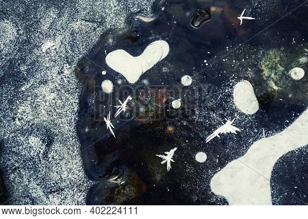 Beautiful Ice With Air Bubbles And Hoarfrost On The Frozen Lake. Macro Image. Heart-shaped Air Bubbl