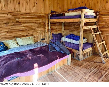 Photograph Of Bunk Beds Inside A Wooden Cottage