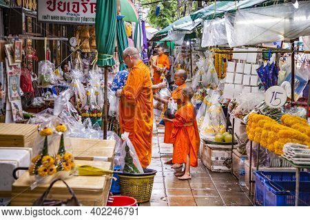 Bangkok, Thailand - May 12, 2009: Monks Get Their Morning Gift At The Nightly Flower Market Pak Klon