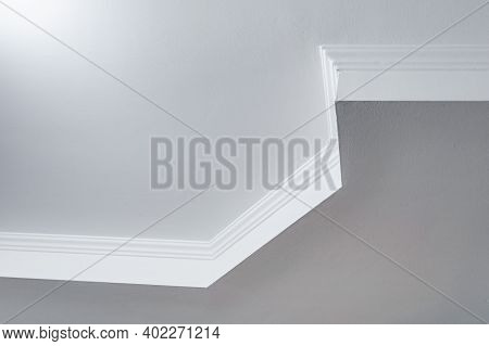 Detail Of Corner Ceiling With Intricate Crown Molding. Suspended Ceiling And Drywall Construction In