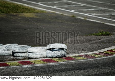 A Detail Picture Of A Part Of The Racetrack. The Chicane With Curbs And Tires Can Be Seen.