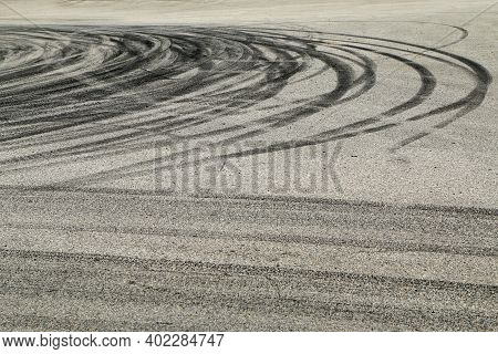 The Rubber Tracks From The Rallye Cars Left On The Tarmac In The Hairpin.