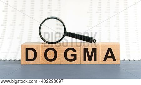 Wooden Blocks With The Text: Dogma. Dogma Word Made With Building Blocks, Business Concept