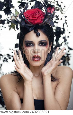 Pretty Brunette Woman With Rose Jewelry, Black And Red, Bright Make Up Kike A Vampire Closeup Red Li