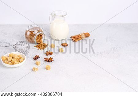Ingredients For Dalgon Coffee Korean Drink On A Gray Background. Instant Coffee, Anise, Cinnamon, Ca