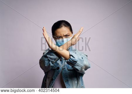 Asian Woman Wearing Protective Face Mask Showing Arms Crossed Making Stop Sign Isolated On White Bac