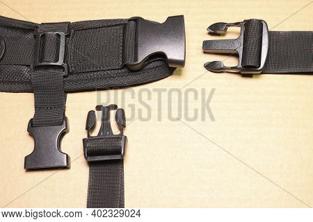 Black Plastic Buckle Fastex For Backpacks. Accessories For Backpacks, Fastener Close-up.