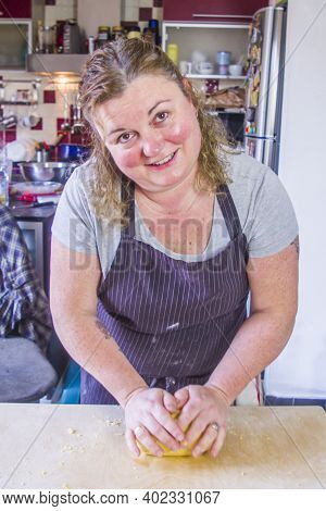 Italian Housewife Prepares Egg Pasta, With Flour, Water, Egg, Salt, For The Party Lunch.