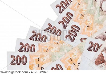 200 Czech Korun Bills Lies In Different Order Isolated On White. Local Banking Or Money Making Conce