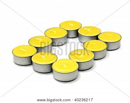 Close up yellow Candles on white background