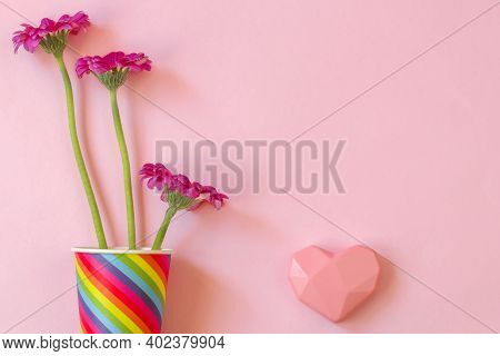 Valentines Day. Paper Cup Rainbow And Gerbera ,heart On Soft Pink Background. The Concept Of Gay Pri