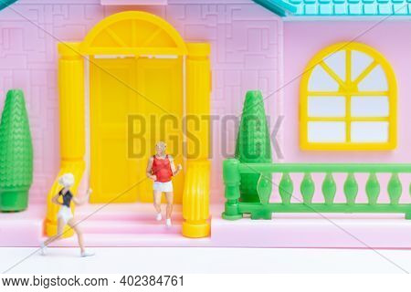 Miniature People , Couple Running Near Their House Together