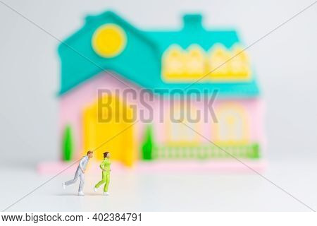 Miniature People , Couple Running Near Their House Together