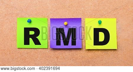 On A Beige Background, Multi-colored Stickers For Notes With The Word Rmd