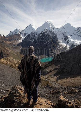 Male Hiker In Traditional Poncho Cordillera Huayhuash Circuit Andes Mountain San Antonio Pass Laguna