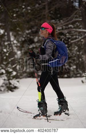 Woman Doing Ski Mountaineering In The Mountains In The Pyrenees In Europe In Winter 2020.