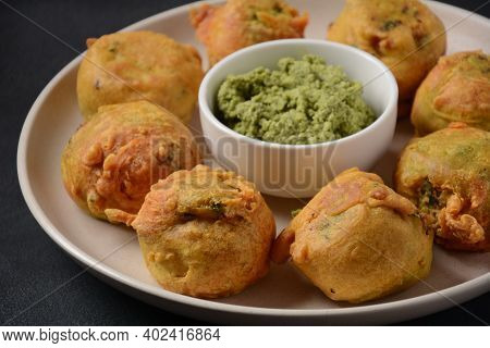 Batata Vada  Popular Street Food Of India, Served With  Green Chutney.