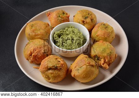 Batata Vada  Popular Street Food Of India, Served With  Green Chutney.