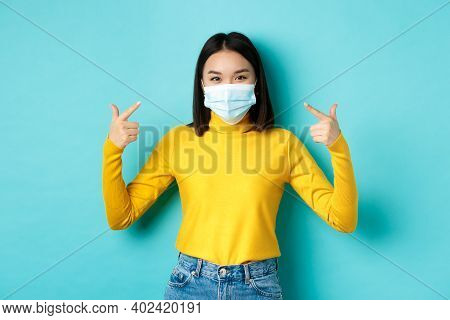 Covid-19, Social Distancing And Pandemic Concept. Young Asian Woman Protect Herself From Coronavirus