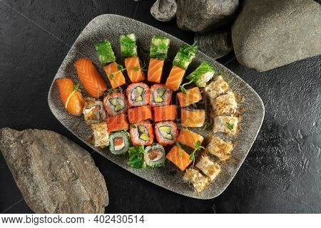 Big Sushi Set. Sushi Rolls And Nigiri With Salmon, Avocado, Tobiko Caviar, Tuna Flakes, Chuka Salad.