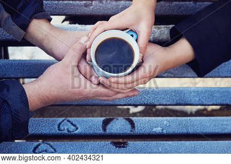 A Man And A Woman Holding Cups Of Tea. Winter Walk In A Park. Light-blue Coffee Mug. Top View.