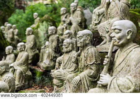 groups of buddhist arhat stone statue in the garden