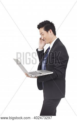 Business Man Holding Laptop Computer And Phono High Quality Photo