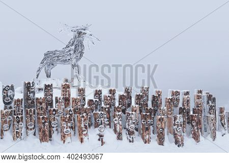 Perm Krai, Russia - January 02, 2021: Snow-covered Art Object In The Form Of A Group Of Idols Depict