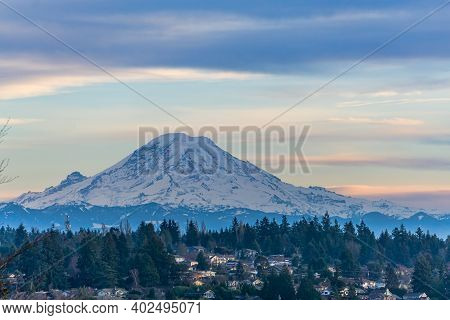 A View Of Mount Rainier With Clouds Above.