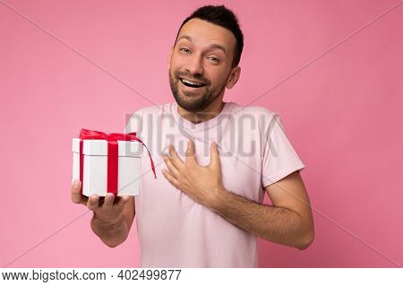 Photo Shot Of Handsome Positive Msmiling Brunette Unshaven Young Man Isolated Over Pink Background W