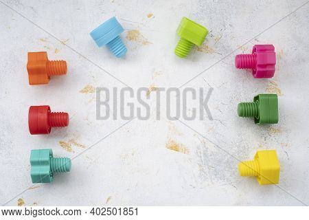 Educational Constructor For Children, Nuts And Bolts In The Form Of Geometric Shapes. Mock Up Backgr