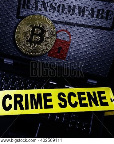 Ransomware And Bitcoin On A Laptop Screen With Crime Scene Tape