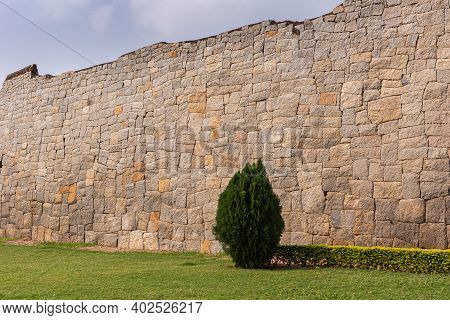Hampi, Karnataka, India - November 5, 2013: Zanana Enclosure. Tall No-cement Historic Wall Around Th