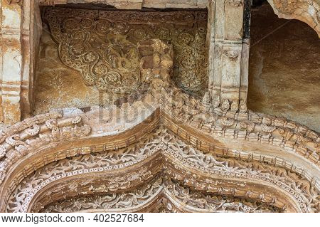 Hampi, Karnataka, India - November 5, 2013: Zanana Enclosure. Closeup Of Damaged Decorated Brown Sto