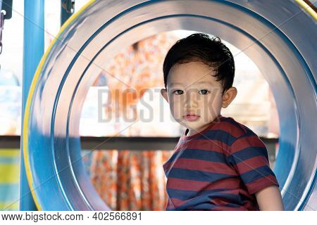 Asian Boy Portrait Tired Expression, Little Boy Playing At The Park On The Playground For Kids & Chi