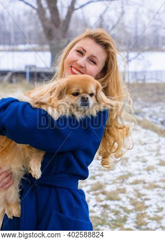 Nice Young Woman On A Walk With Her Dog Resting At Park. Best Friendship Girl And Senior Dog. Psycho