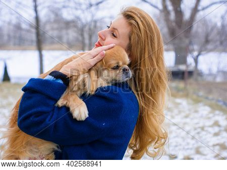 Nice Young Woman On A Walk With Her Dog Resting At Park. Best Friendship Girl And Senior Dog. Psycho