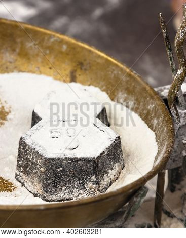 Weight In A Steelyard On A Craftsman Market.vertical Image.