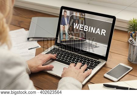 Female Hands Typing On Laptop With Webinar Inscription On Screen, Cropped. Unrecognizable Business W