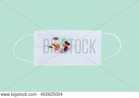Anti-coronavirus Drugs Put On A White Mask, Medicine And Drug Concept.