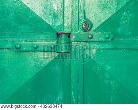 Garage Entry Locked With Theft Resistance Locking Latch And Locking Security Insert. Cracked Painted