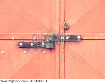 Red Industrial Metal Warehouse Door With Security Locked Latch Lock And Safety Lock Insert In Harden