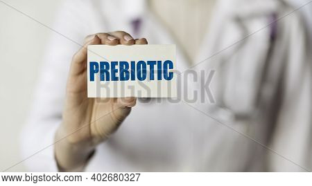 Doctor Holding A Card With Text Word Prebiotic, Medical Concept.