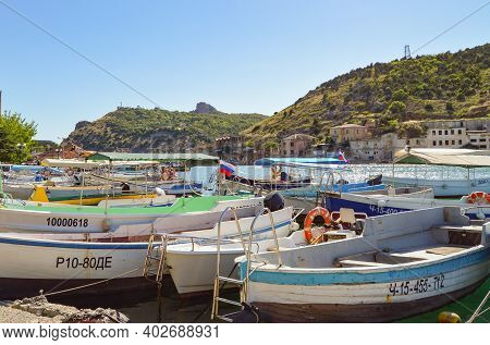 Balaklava, Sevastopol, Crimea, Russia-june 02, 2018: Boats And Boats Moored To The Shore Of Balaklav