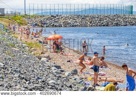 Summer, 2016 - Vladivostok, Russia - Water Area Of Fedorov Bay In Vladivostok. People Swim And Sunba